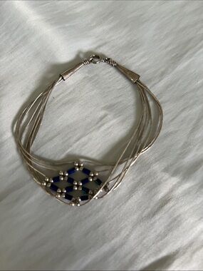 Silver liquid bead Multi-Strand Bracelet with Blue and Green seed bead.